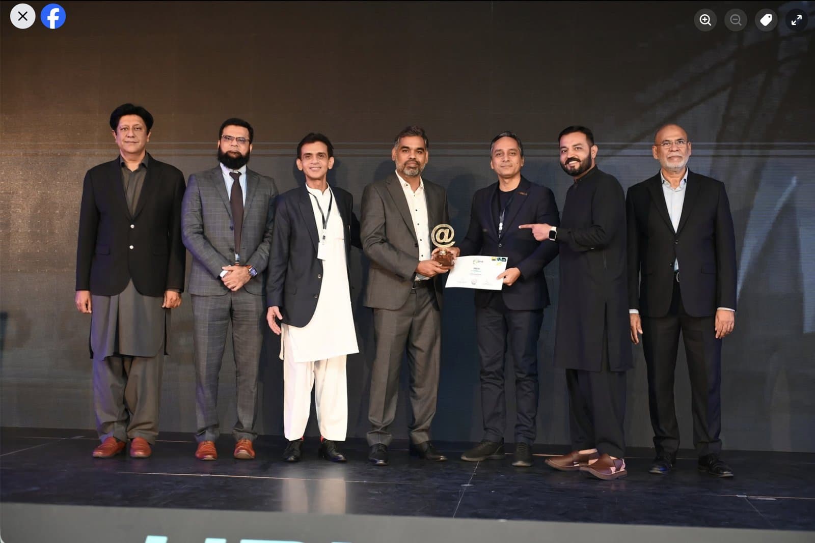 The Tribe Consulting team receiving the Best in BPO award on stage at the HBL P@SHA ICT Awards 2024 in Islamabad